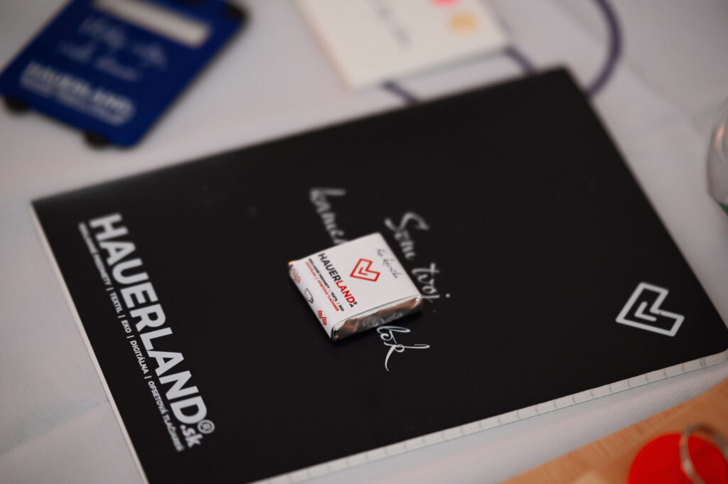 Notebook with branded candy on table